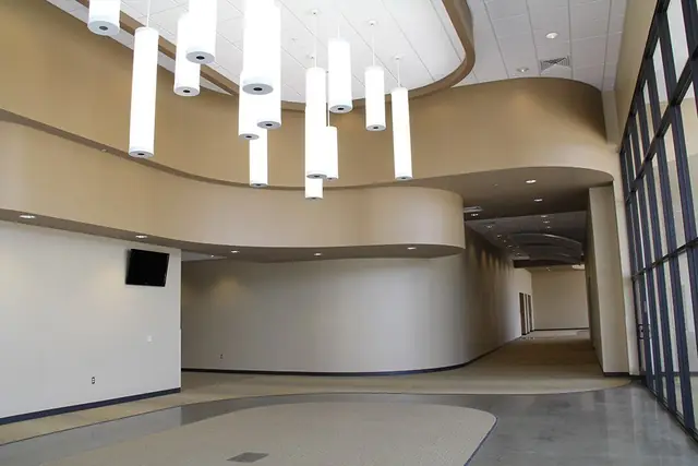 A commercial lobby in East Texas with freshly painted curved walls in tan and taupe